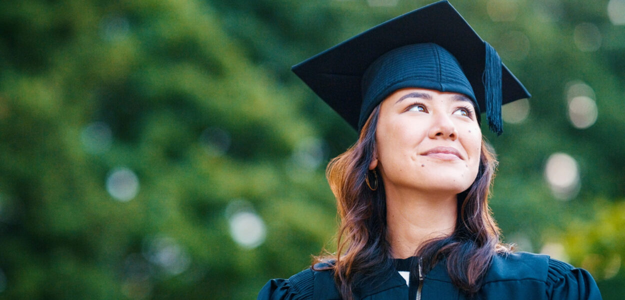 University student, woman and outdoor for graduation with memory, smile or thinking or achievement at campus. Girl, Japanese person and graduate with memory, decision or choice for future at college